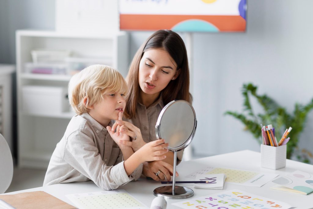 Young boy in therapy for Orofacial Myofunctional Disorder with a speech therapist in Quebec city